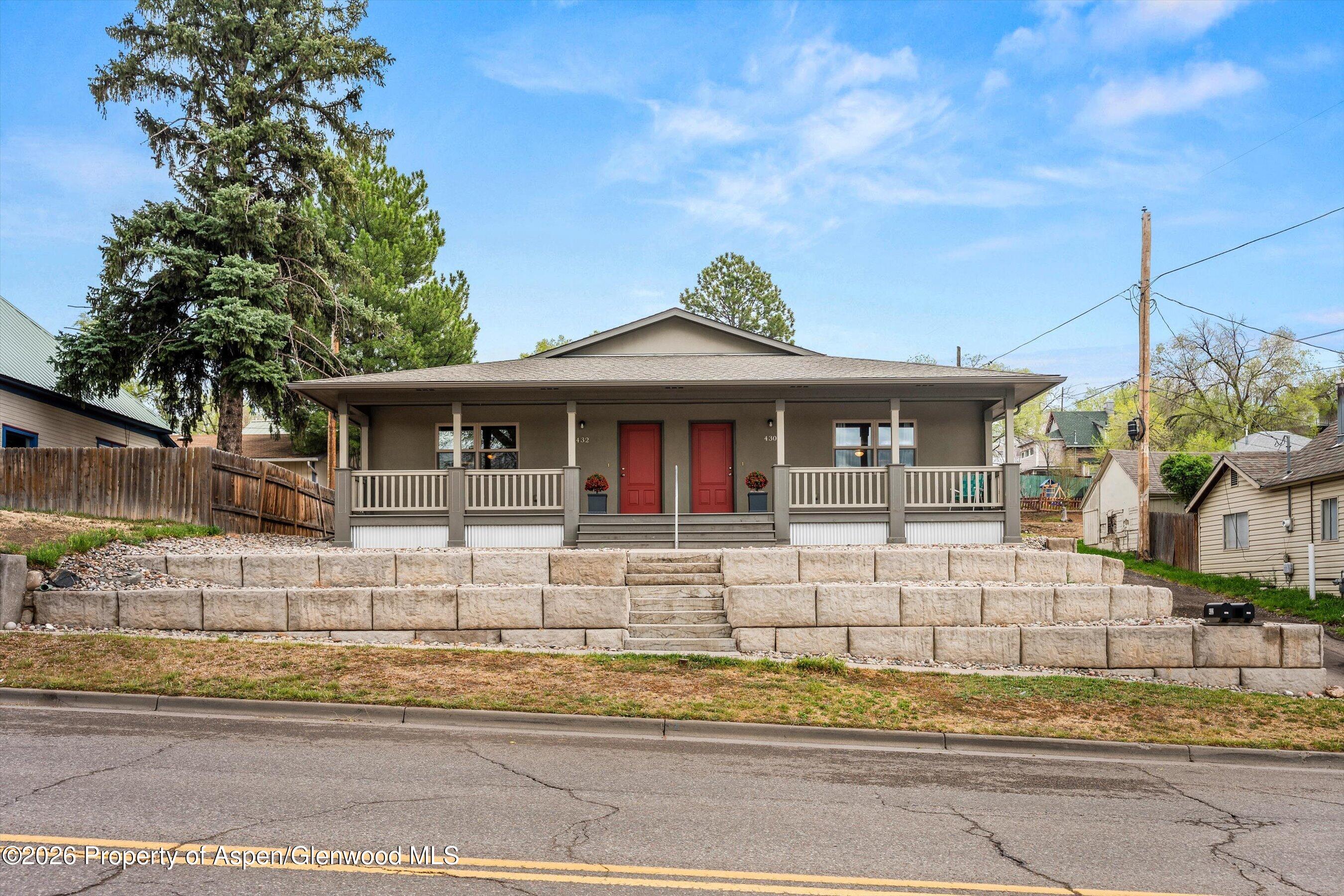 430-432 Whiteriver Avenue Rifle, CO 81650 - Photo 23 of 27 a front view of a house with a garden