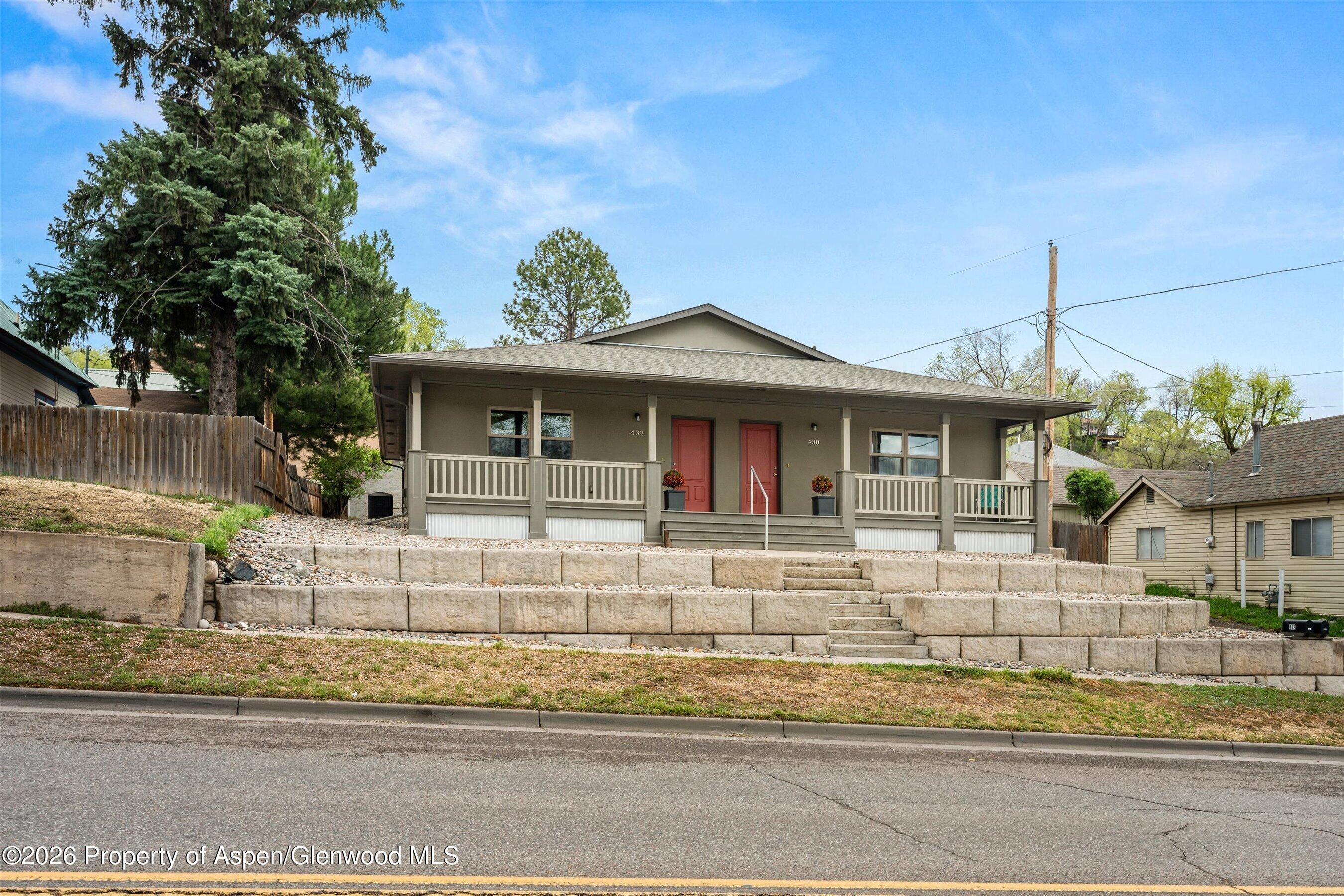 430-432 Whiteriver Avenue Rifle, CO 81650 - Photo 24 of 27 a front view of a house with a yard