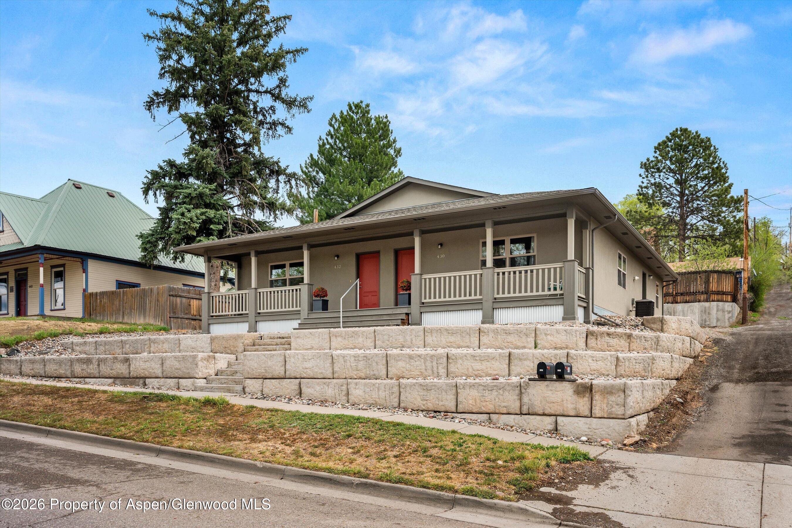 430-432 Whiteriver Avenue Rifle, CO 81650 - Photo 25 of 27 front view of a house with a yard