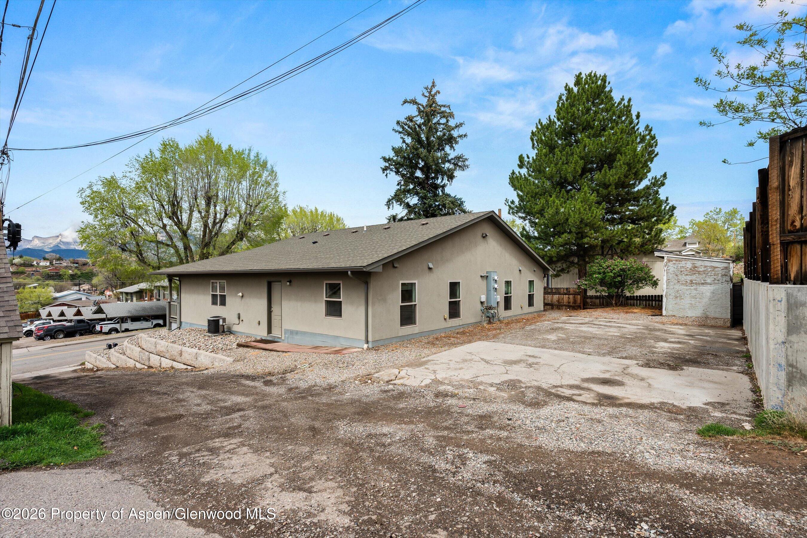 430-432 Whiteriver Avenue Rifle, CO 81650 - Photo 27 of 27 a house with trees in the background