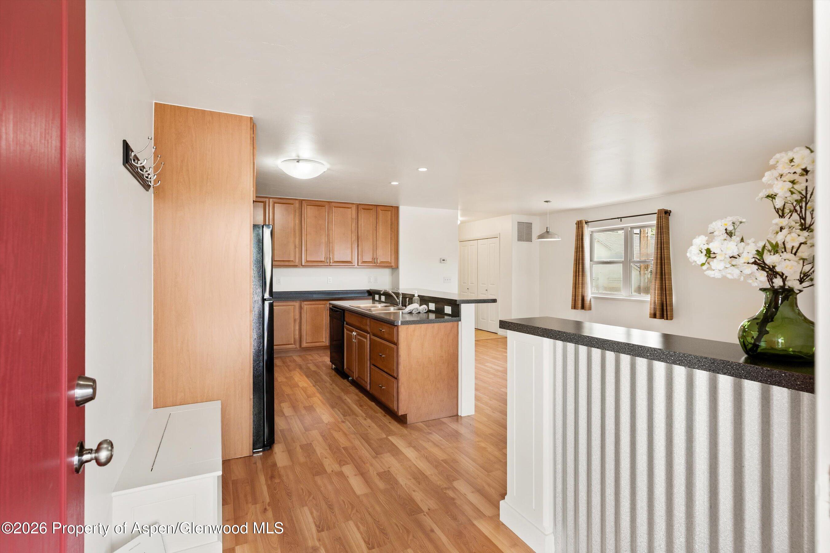 430-432 Whiteriver Avenue Rifle, CO 81650 - Photo 3 of 27 a view of a kitchen with a sink and cabinets