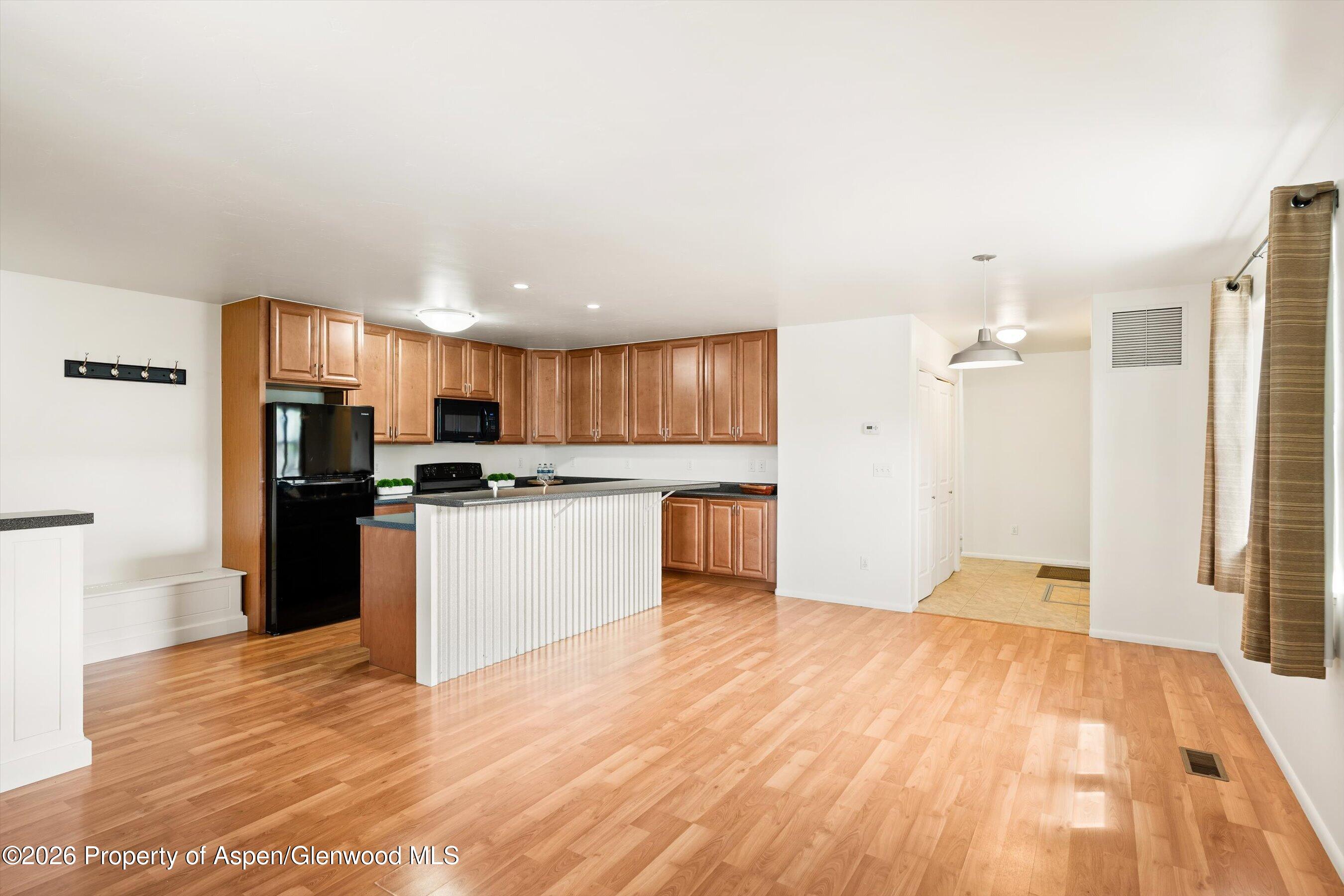 430-432 Whiteriver Avenue Rifle, CO 81650 - Photo 6 of 27 a kitchen with a refrigerator and a sink
