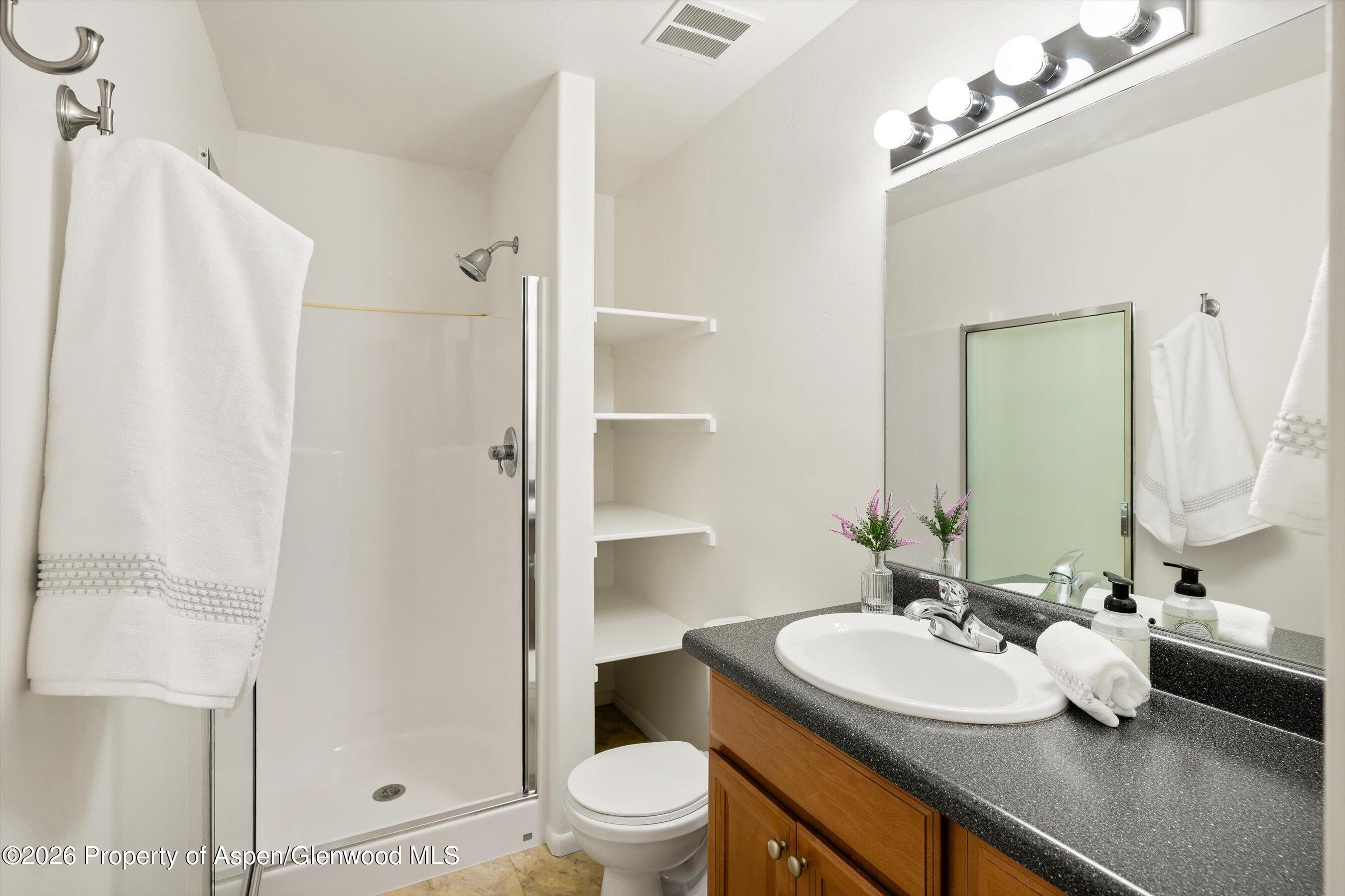 430-432 Whiteriver Avenue Rifle, CO 81650 - Photo 10 of 27 a bathroom with a sink toilet and shower