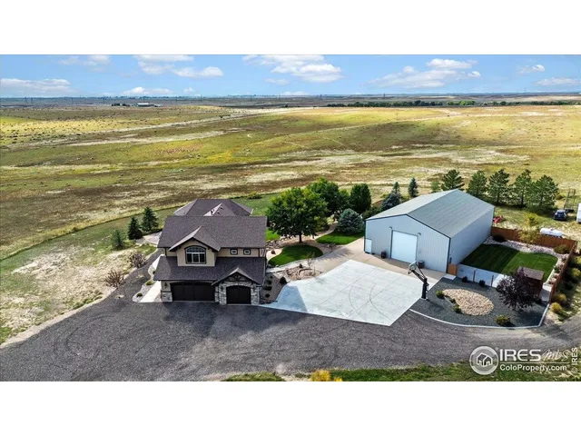a view of a swimming pool with a yard