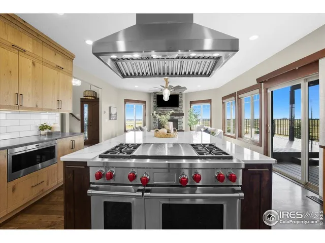 a kitchen with a stove a sink and a refrigerator