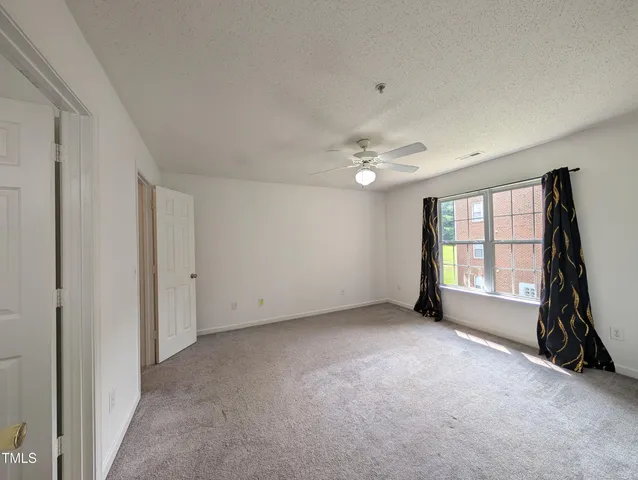 a view of empty room with windows