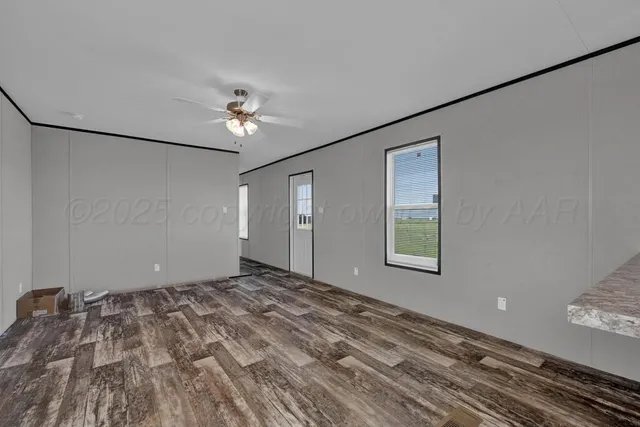 a view of an empty room with a window