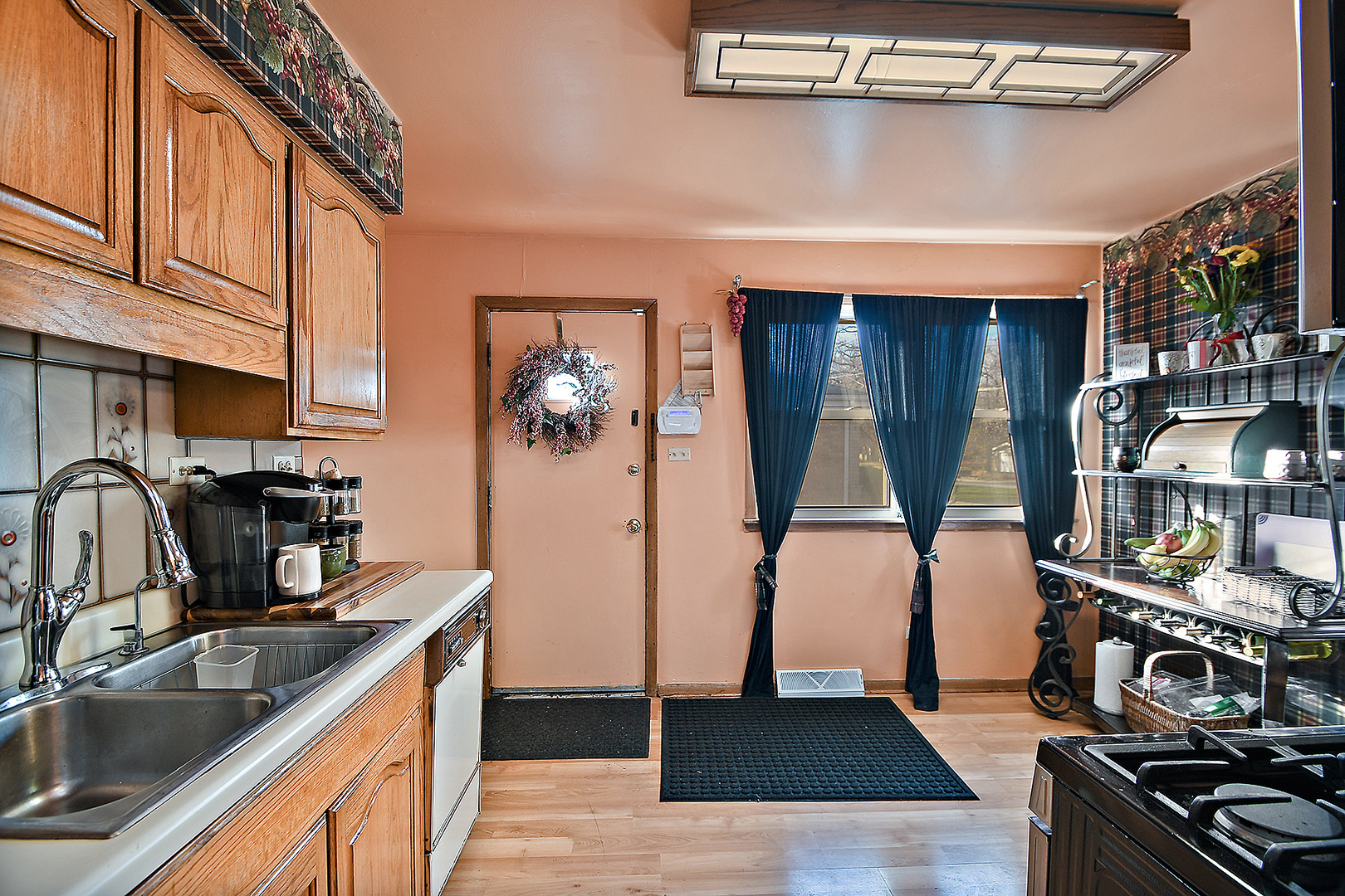 1143 Ridge Road Homewood, IL 60430 - Photo 12 of 26 a kitchen with stainless steel appliances granite countertop a sink dishwasher stove and refrigerator