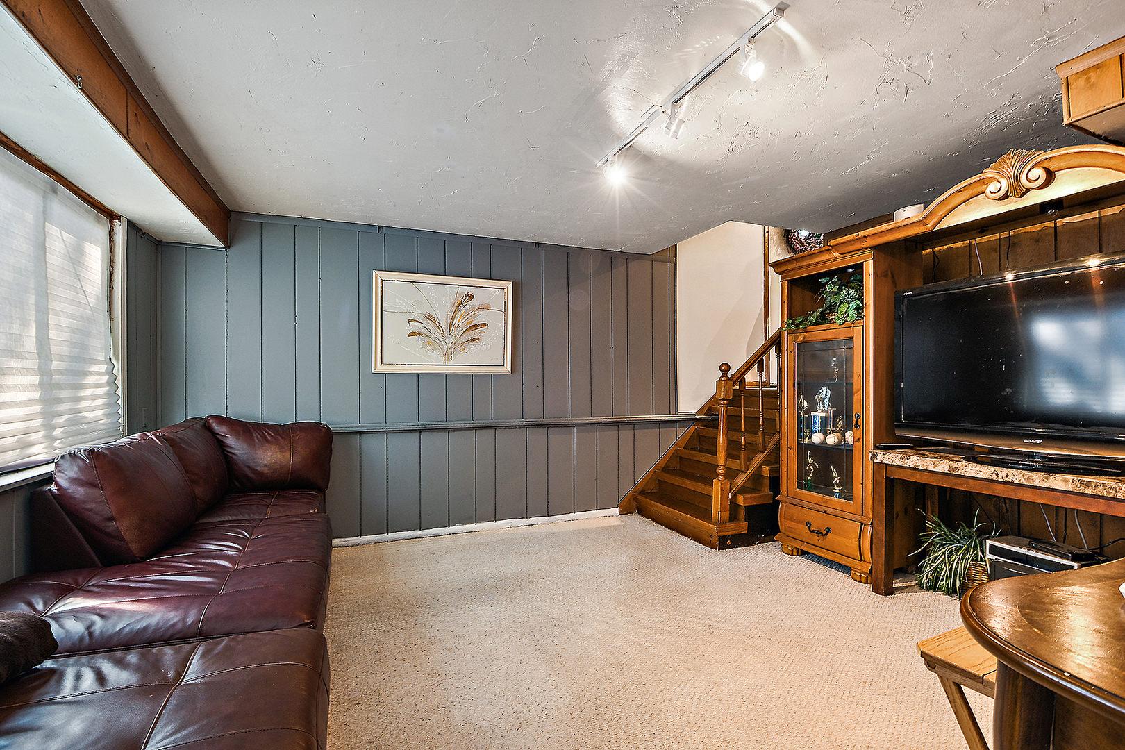 1143 Ridge Road Homewood, IL 60430 - Photo 14 of 26 a living room with furniture and a flat screen tv