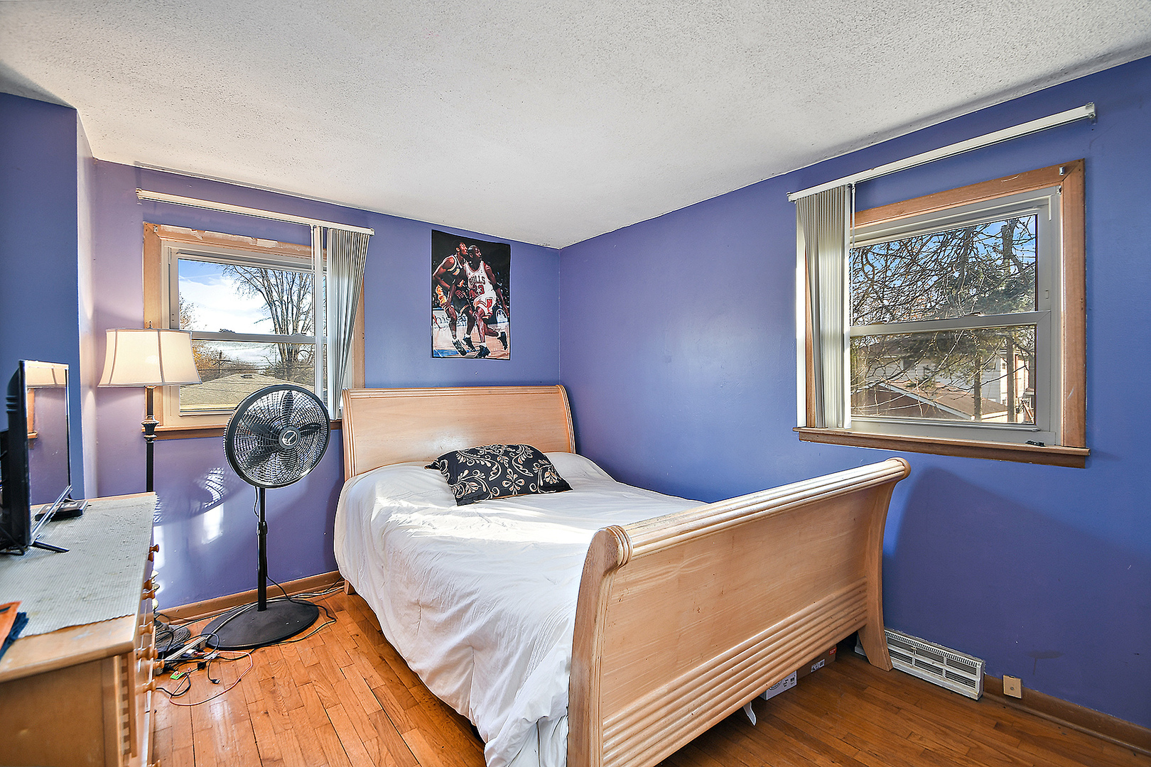 1143 Ridge Road Homewood, IL 60430 - Photo 18 of 26 a bed sitting in a bedroom next to a window