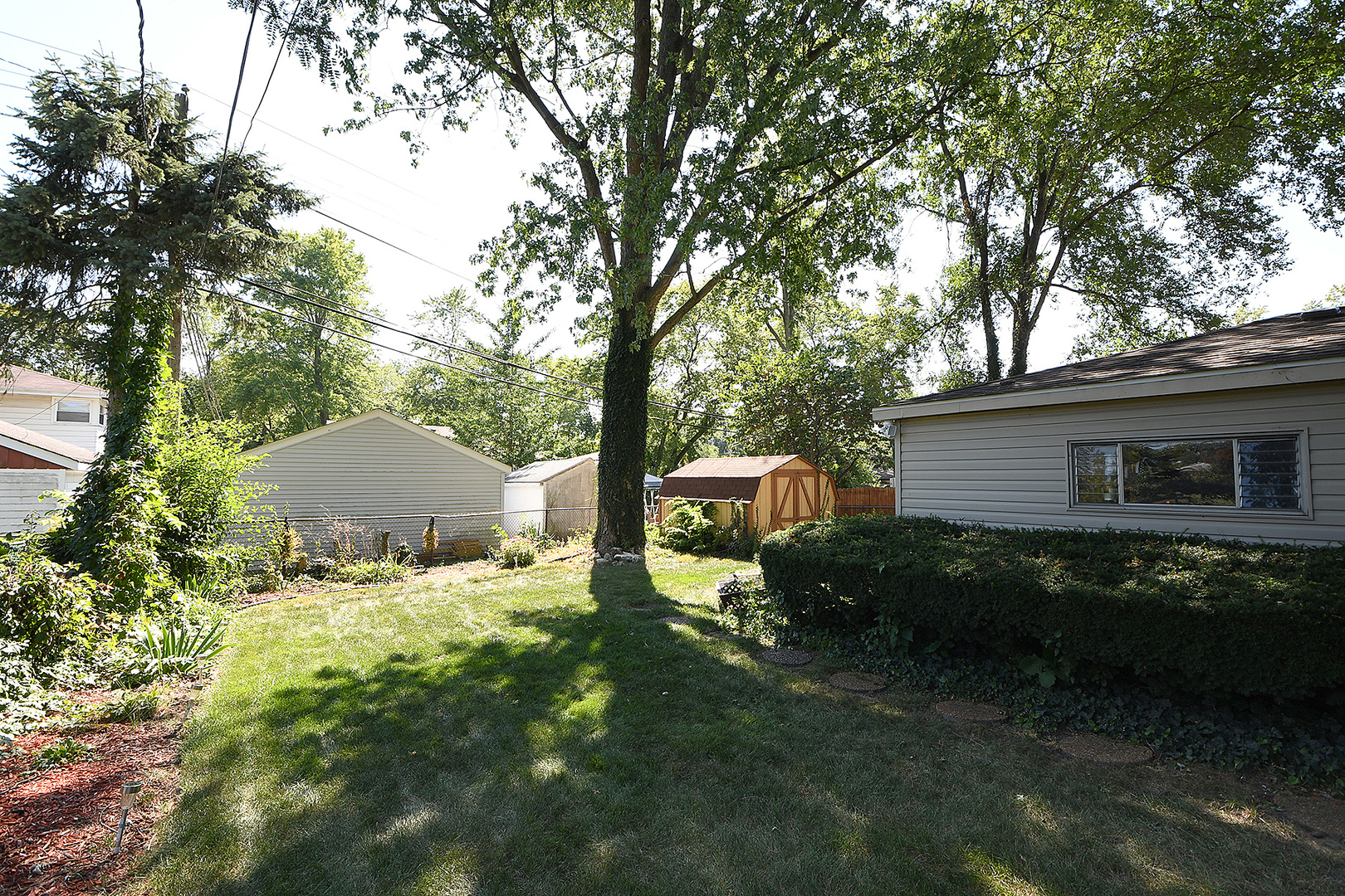 1143 Ridge Road Homewood, IL 60430 - Photo 21 of 26 a backyard of a house with yard and outdoor seating