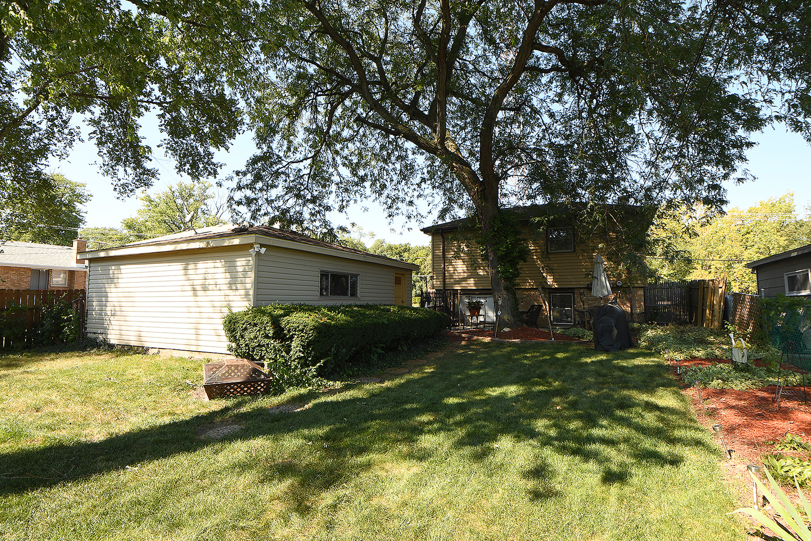 1143 Ridge Road Homewood, IL 60430 - Photo 22 of 26 a view of a house with backyard and a tree