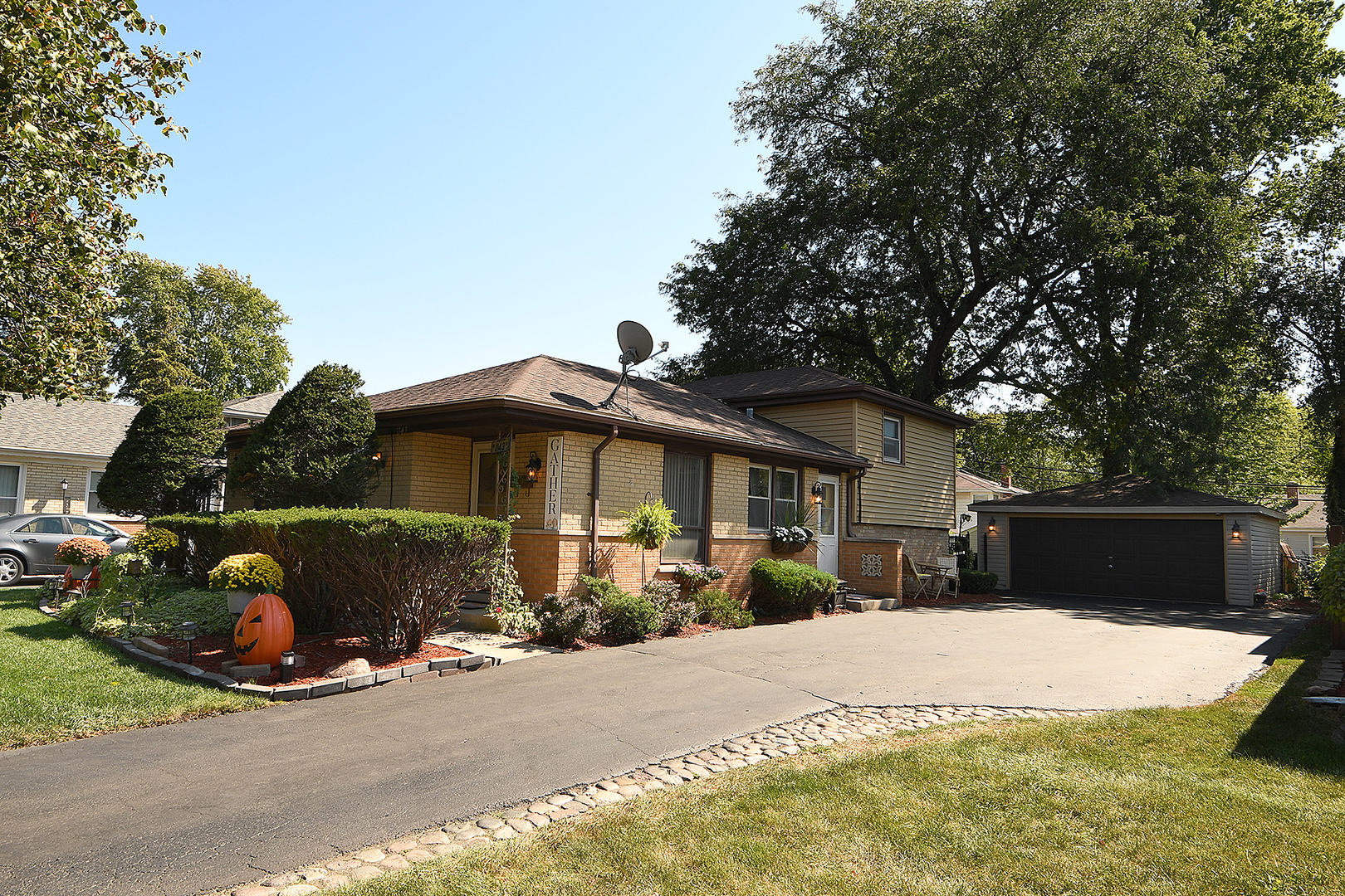 1143 Ridge Road Homewood, IL 60430 - Photo 4 of 26 a front view of a house with a yard and garage
