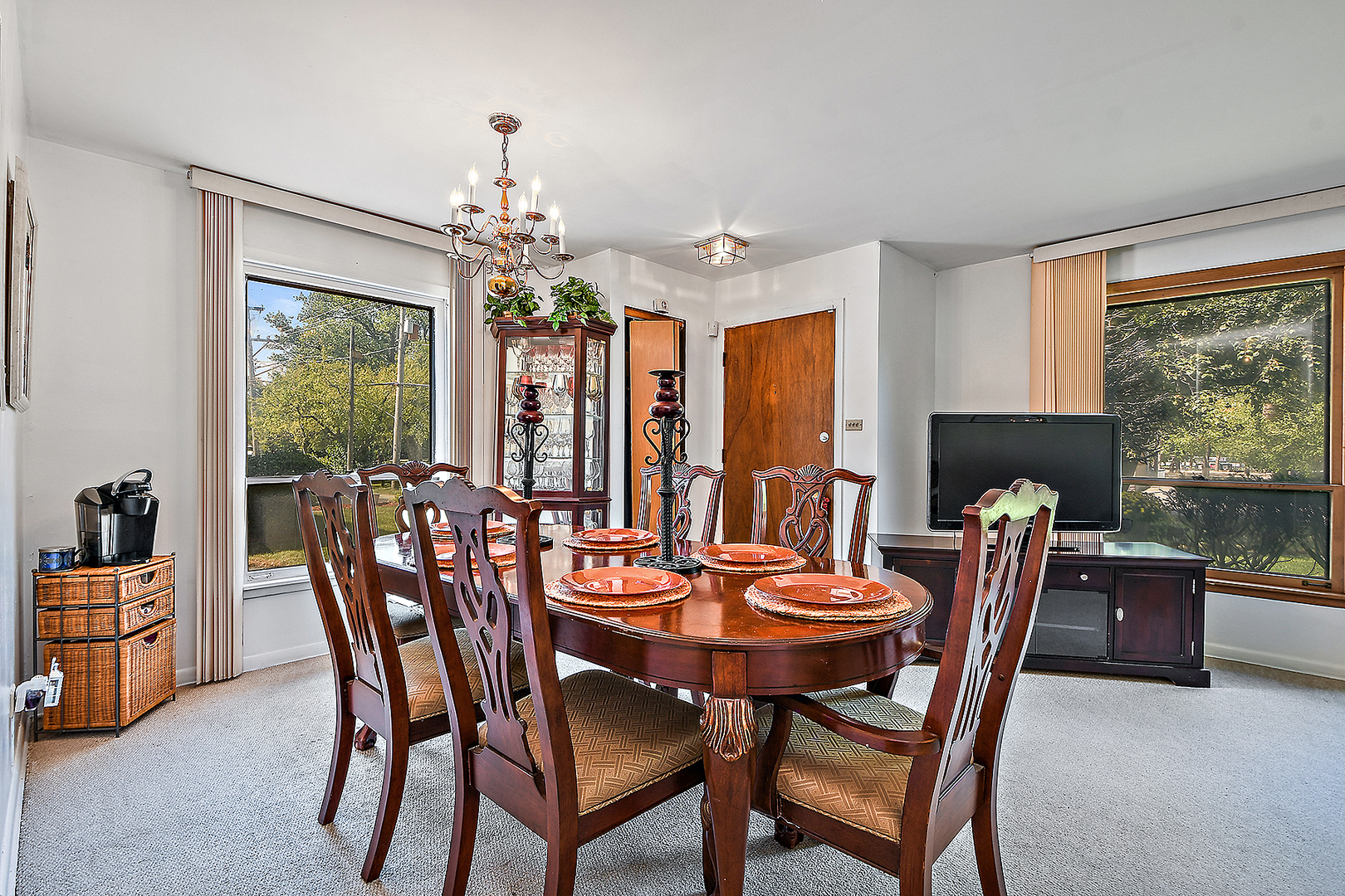 1143 Ridge Road Homewood, IL 60430 - Photo 9 of 26 a dining room with furniture a window and a chandelier