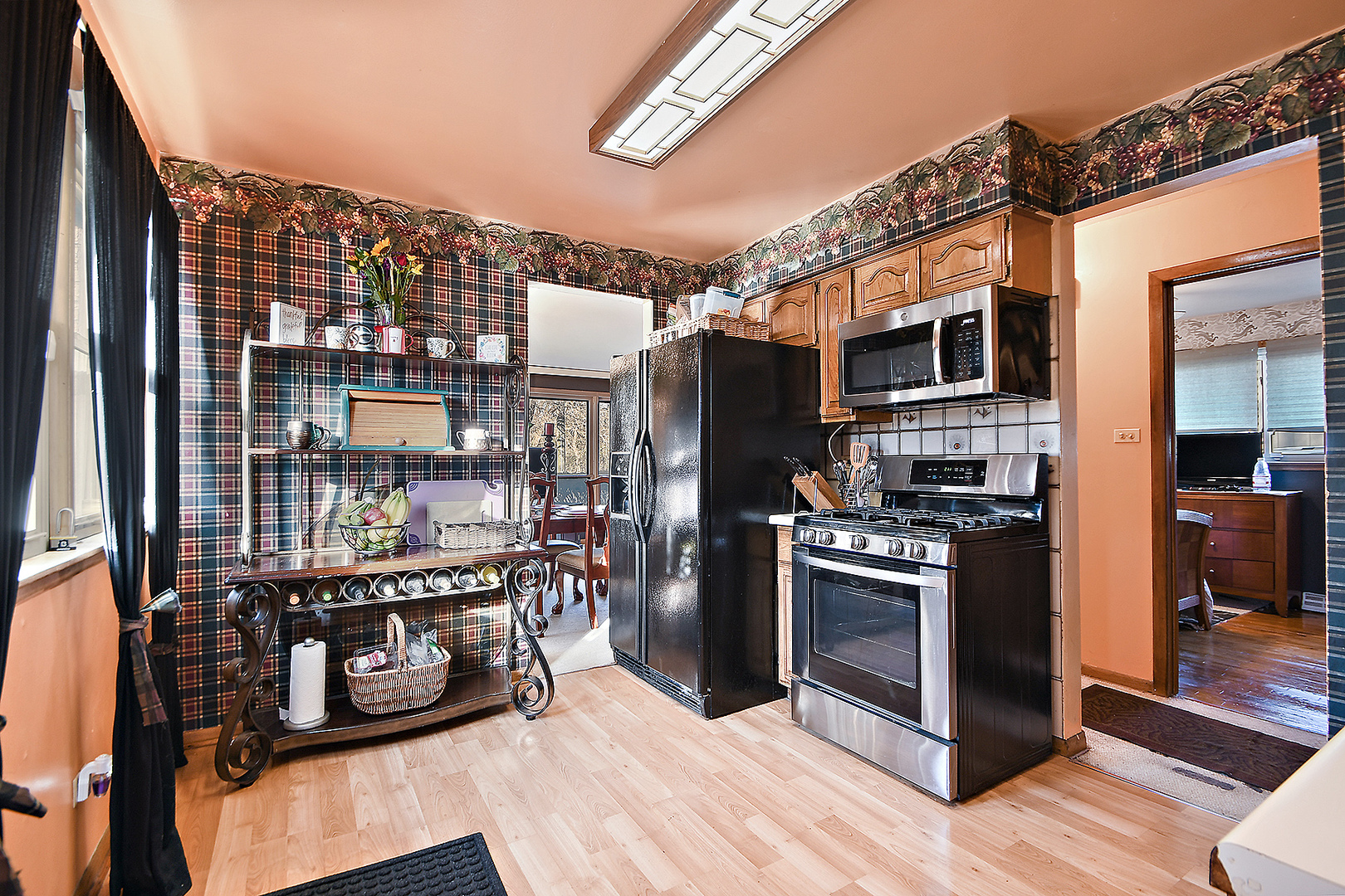 1143 Ridge Road Homewood, IL 60430 - Photo 10 of 26 a kitchen with stainless steel appliances granite countertop a refrigerator and a stove top oven