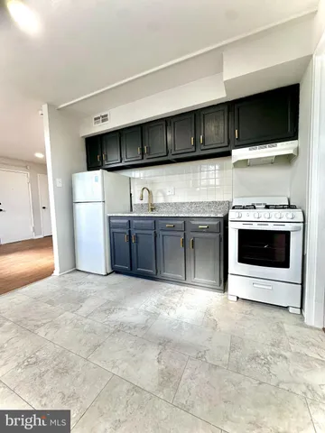 a view of a kitchen with furniture and a fireplace