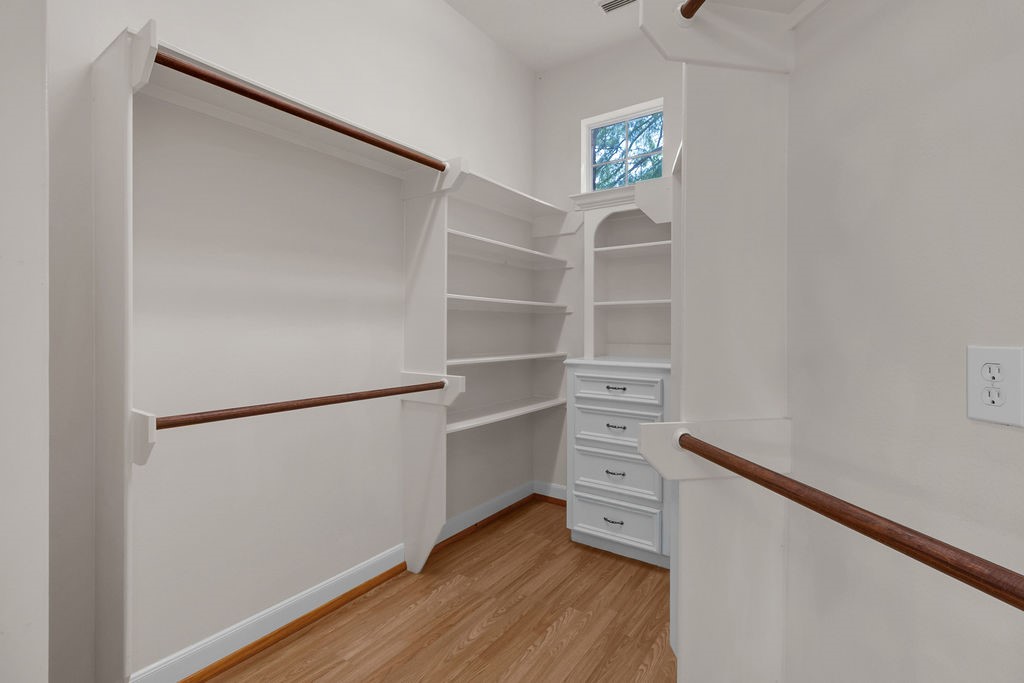7306 Starflower Katy, TX 77494 - Photo 32 of 50 a view of an empty room with wooden floor and closet