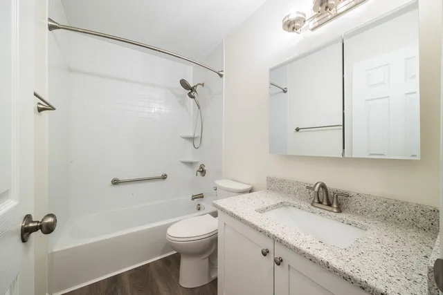 a bathroom with a shower and toilet