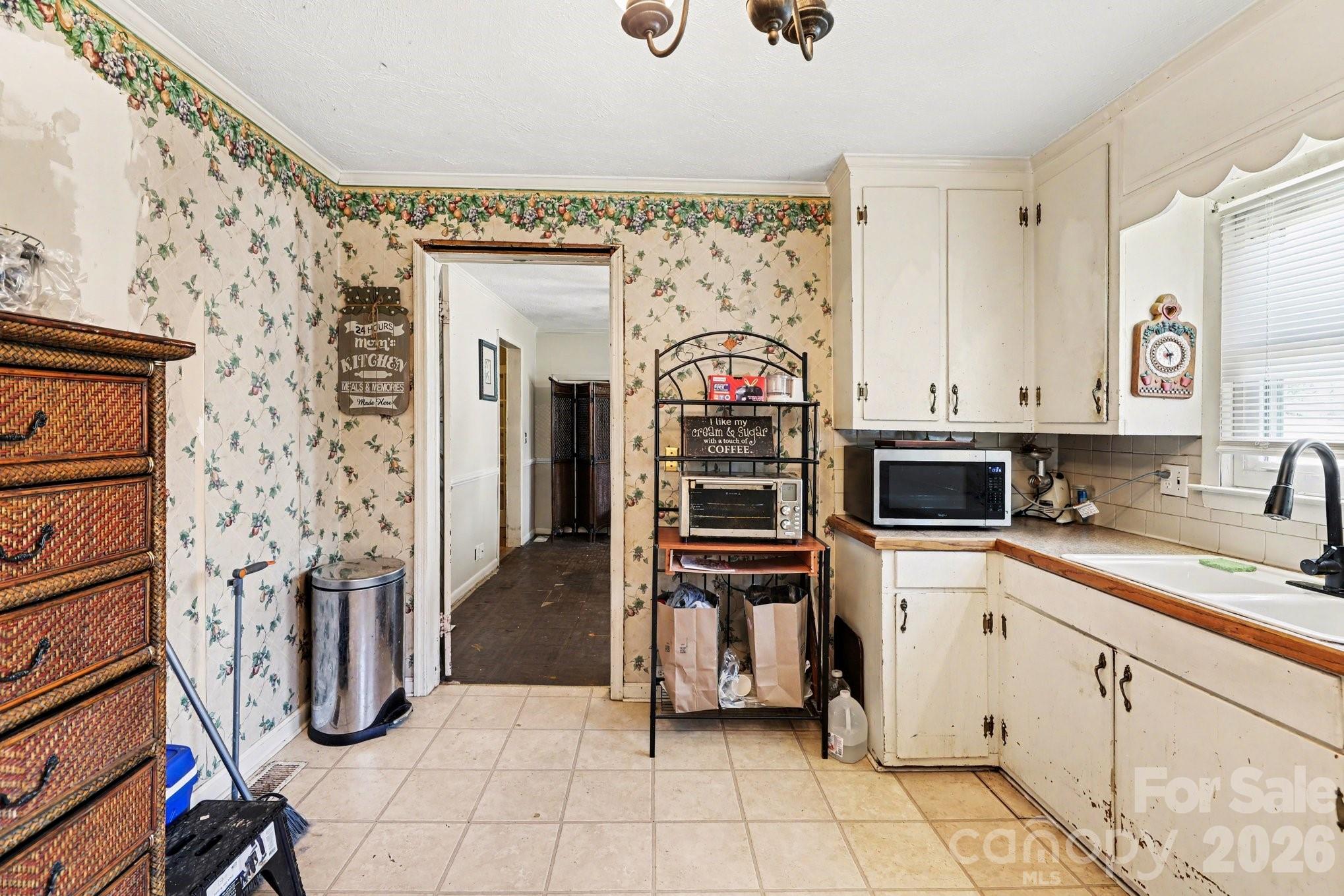 13721 Highway 601 Midland, NC 28107 - Photo 13 of 24 a kitchen with stainless steel appliances kitchen island granite countertop a refrigerator and a sink