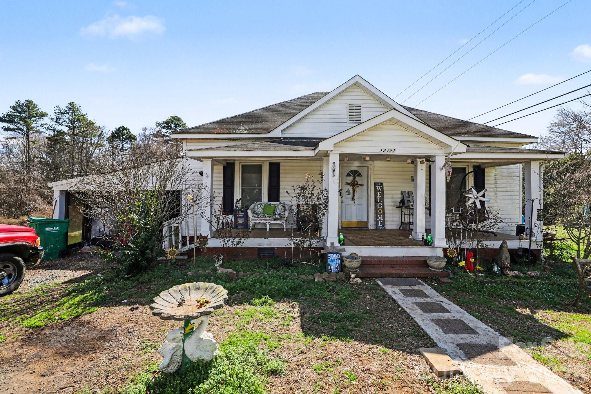 13721 Highway 601 Midland, NC 28107 - Photo 3 of 24 a front view of a house with a yard