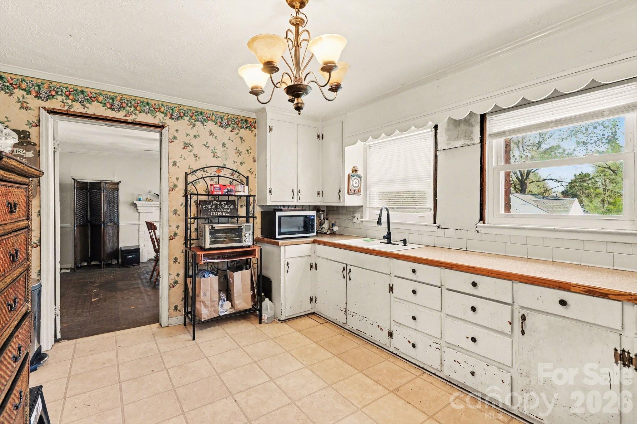 13721 Highway 601 Midland, NC 28107 - Photo 10 of 24 a kitchen with lot of cabinets and window