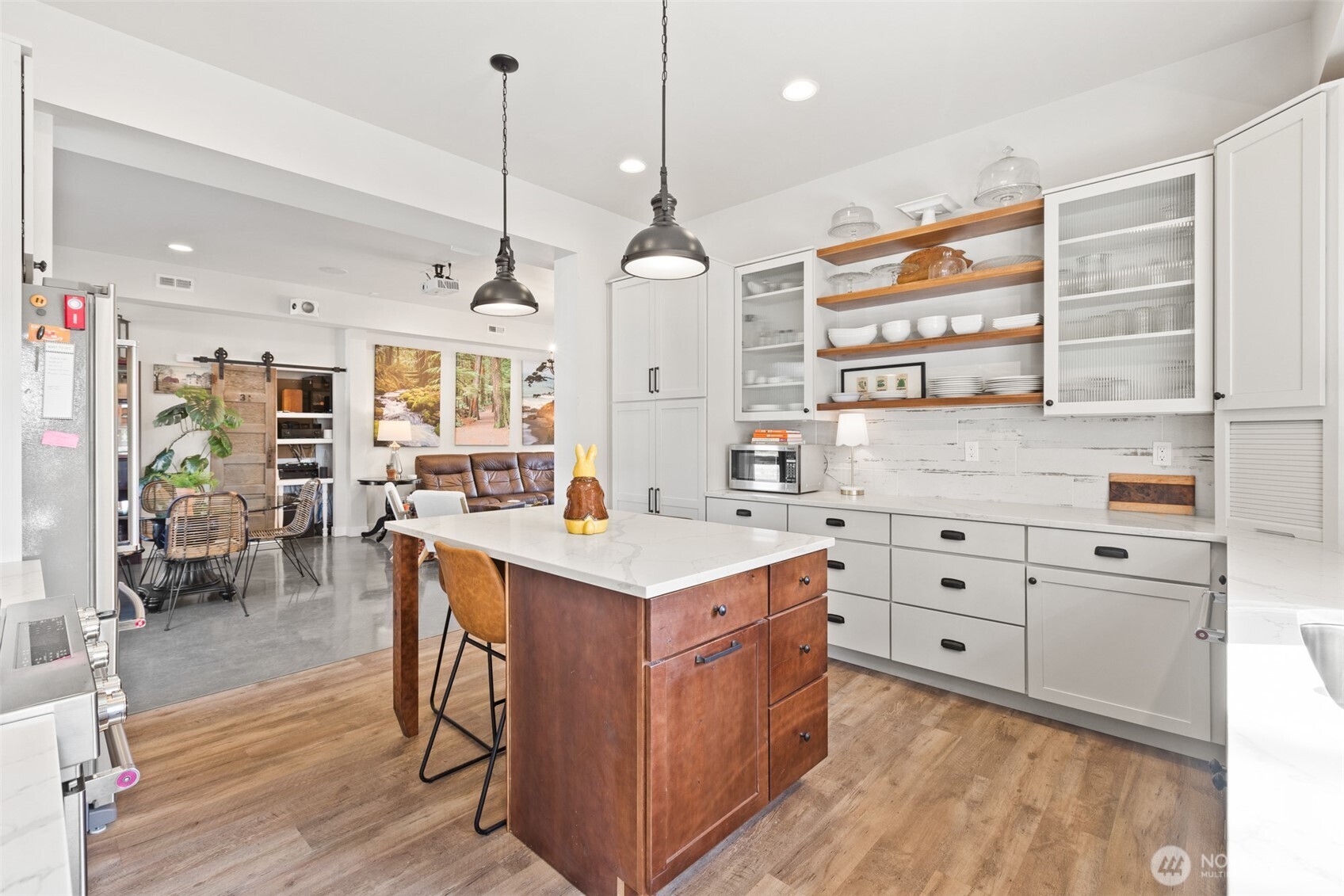 135 Edgington Drive Sequim, WA 98382 - Photo 11 of 40 a kitchen that has a lot of cabinets in it