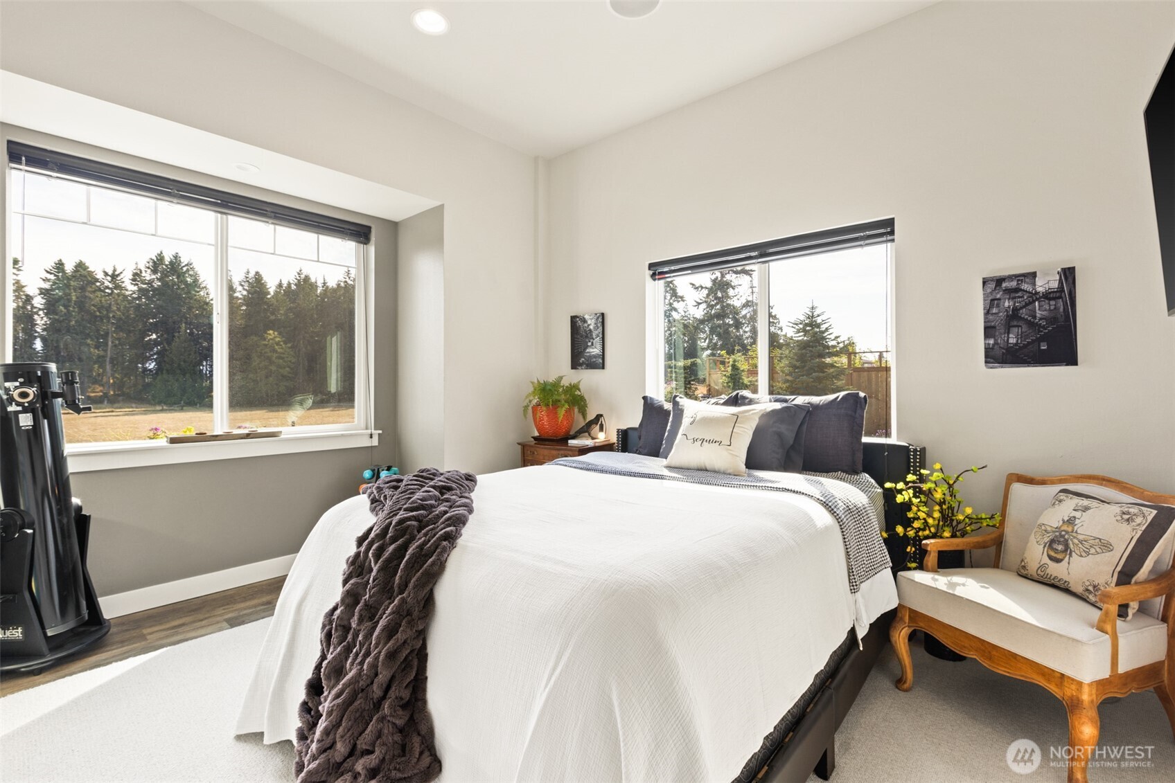 135 Edgington Drive Sequim, WA 98382 - Photo 21 of 40 a bedroom with a bed and glass window