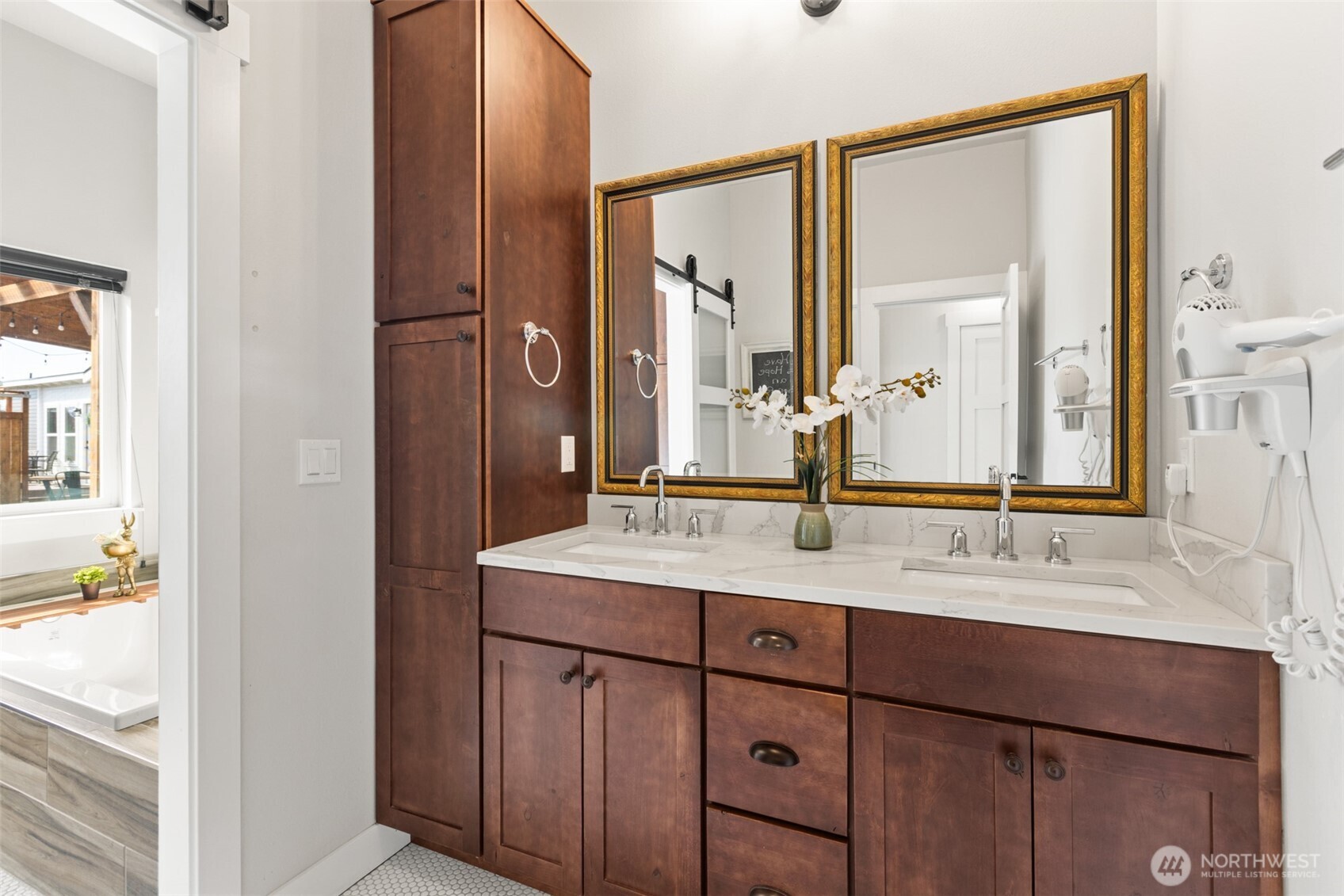 135 Edgington Drive Sequim, WA 98382 - Photo 22 of 40 a bathroom with a sink and a mirror