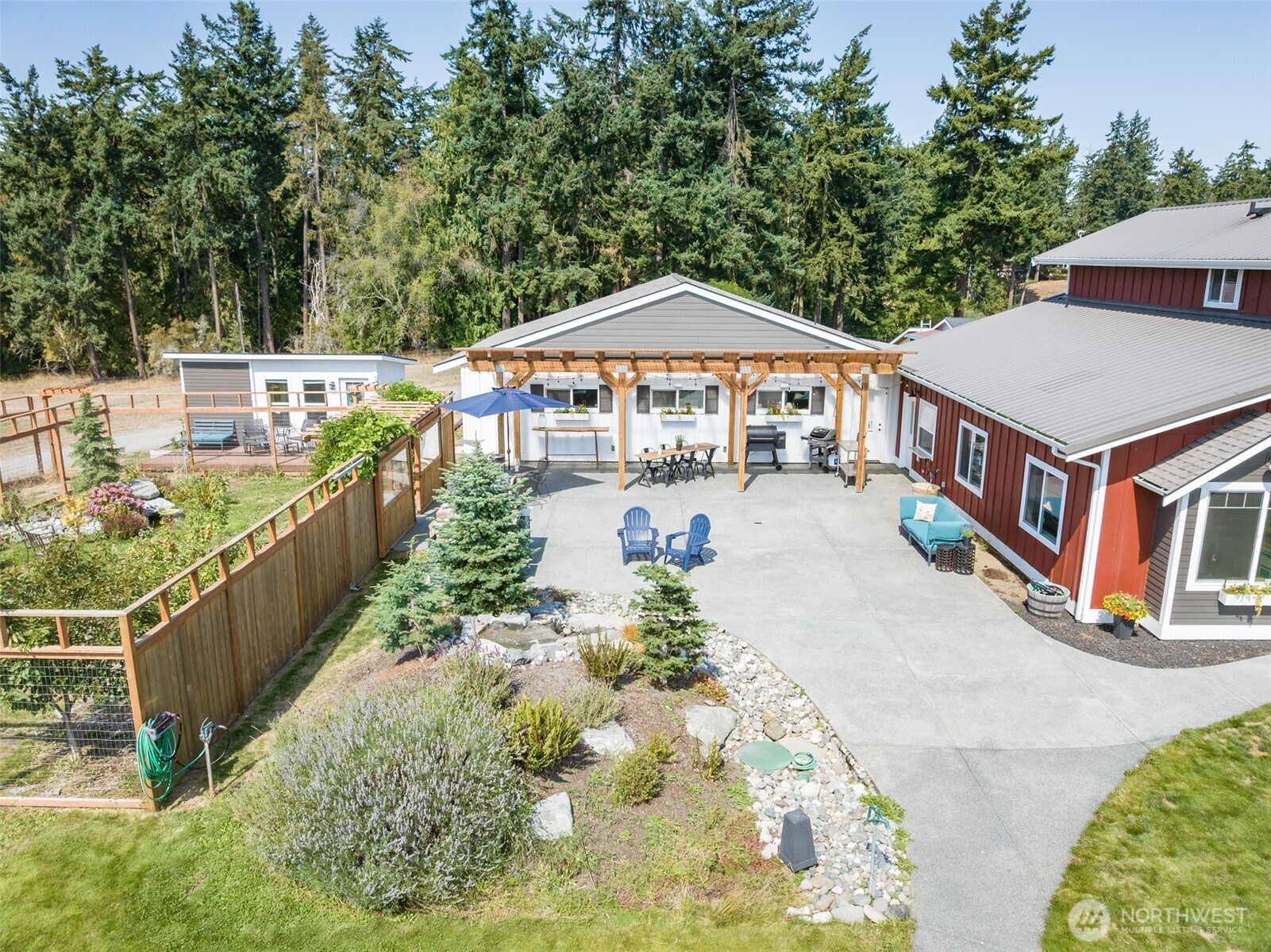 135 Edgington Drive Sequim, WA 98382 - Photo 3 of 40 a balcony with a table and chairs