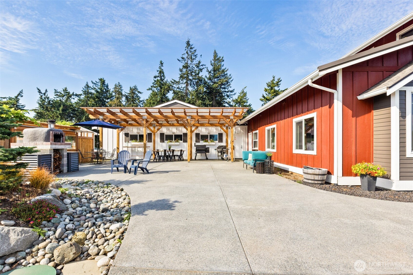 135 Edgington Drive Sequim, WA 98382 - Photo 31 of 40 a building with trees in front of it