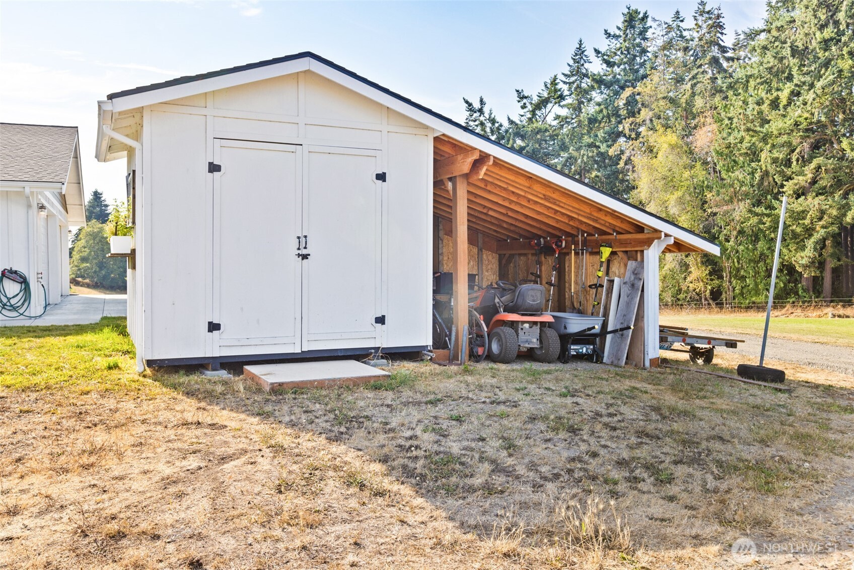 135 Edgington Drive Sequim, WA 98382 - Photo 33 of 40 a view of a house with backyard and sitting area