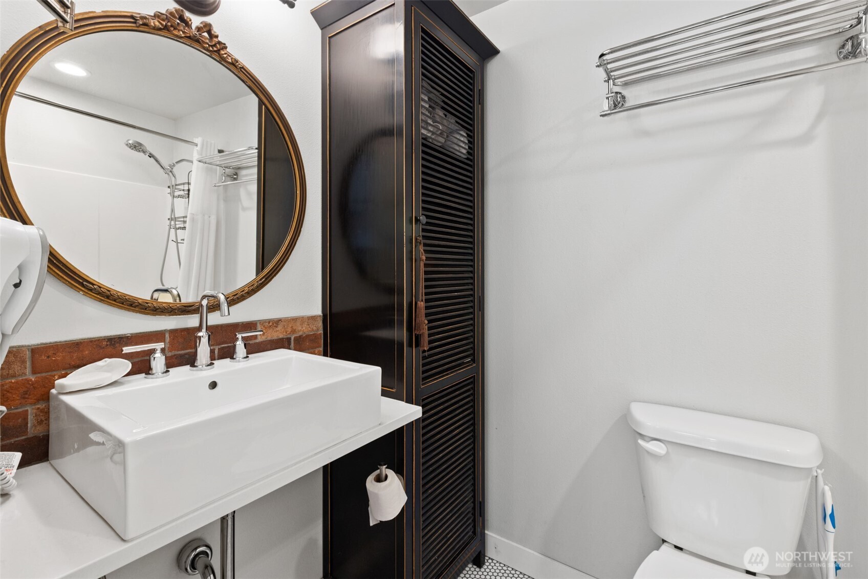 135 Edgington Drive Sequim, WA 98382 - Photo 37 of 40 a bathroom with a sink mirror vanity and toilet