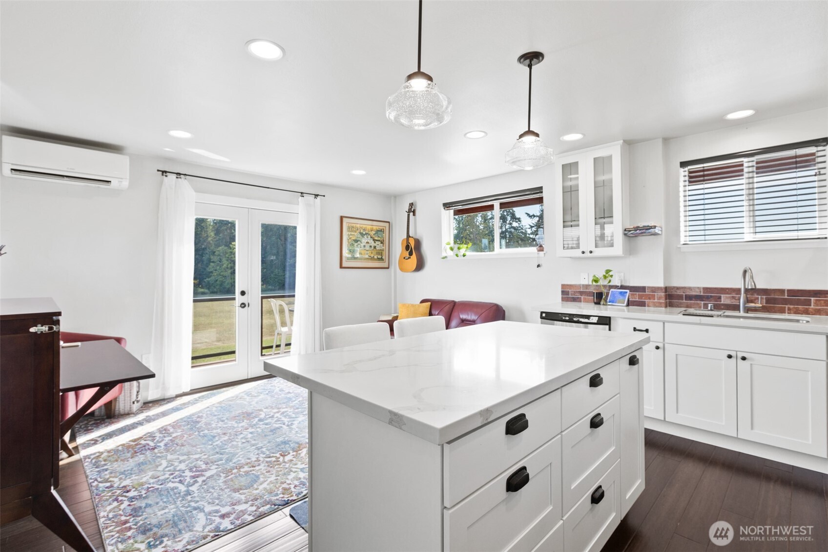 135 Edgington Drive Sequim, WA 98382 - Photo 38 of 40 a kitchen with stainless steel appliances granite countertop a sink and dishwasher with white cabinets