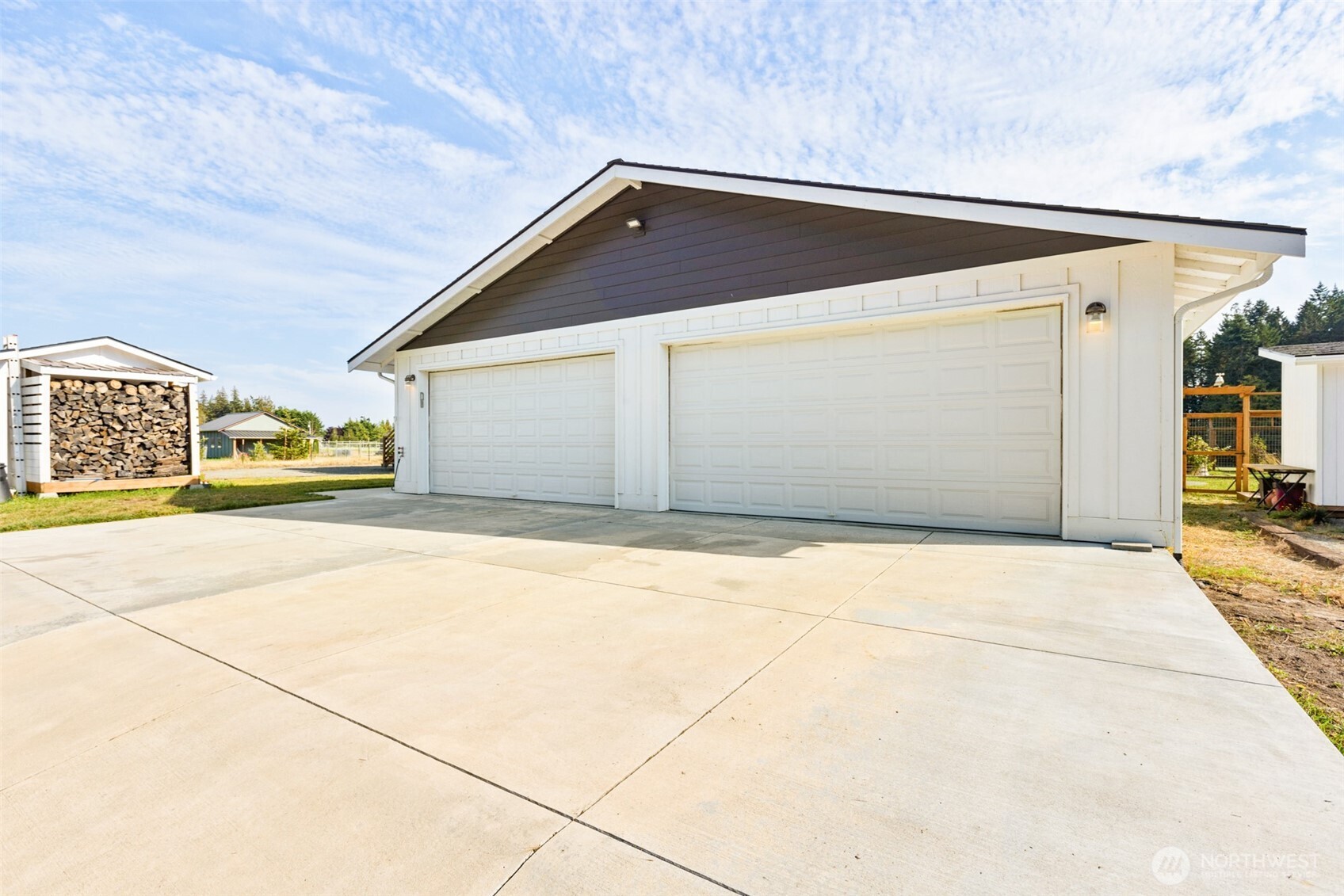 135 Edgington Drive Sequim, WA 98382 - Photo 4 of 40 a view of garage with wooden fence