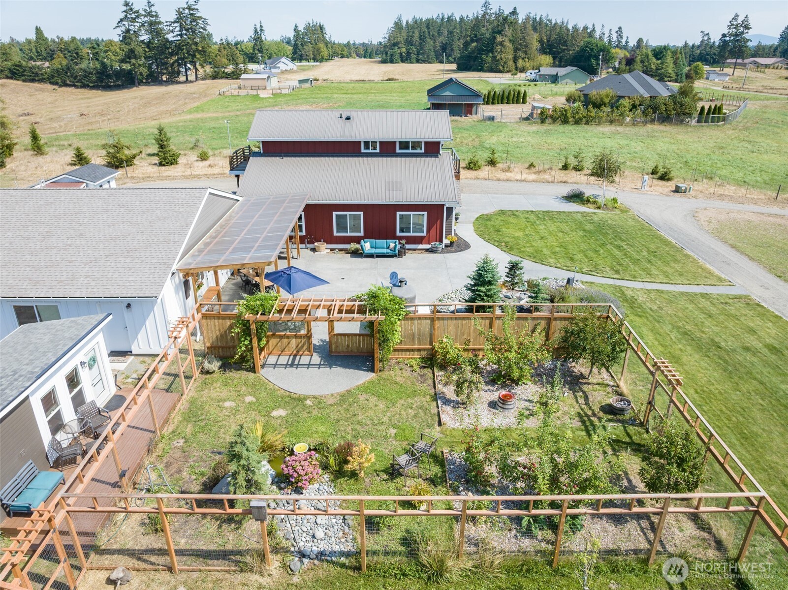 135 Edgington Drive Sequim, WA 98382 - Photo 6 of 40 an aerial view of a house with a yard basket ball court and outdoor seating