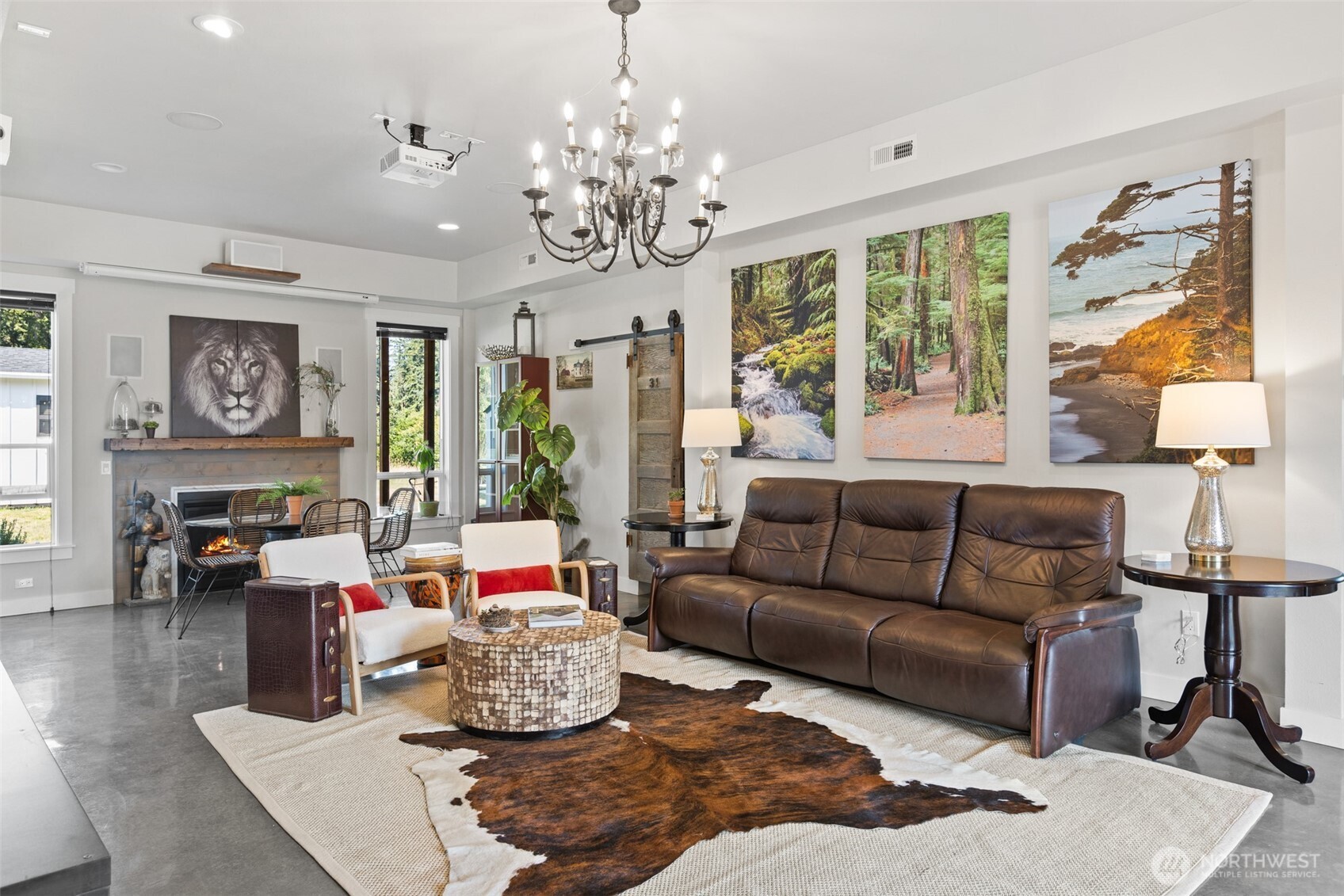 135 Edgington Drive Sequim, WA 98382 - Photo 9 of 40 a living room with furniture and a chandelier
