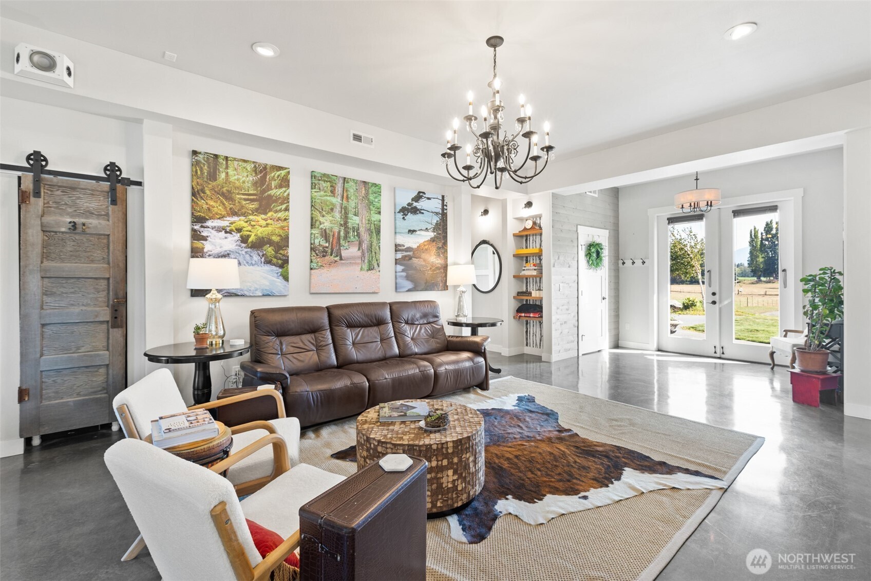 135 Edgington Drive Sequim, WA 98382 - Photo 10 of 40 a living room with furniture chandelier and a table