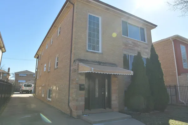 a view of a brick house with a door