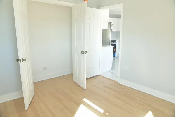 a view of a balcony with wooden floor
