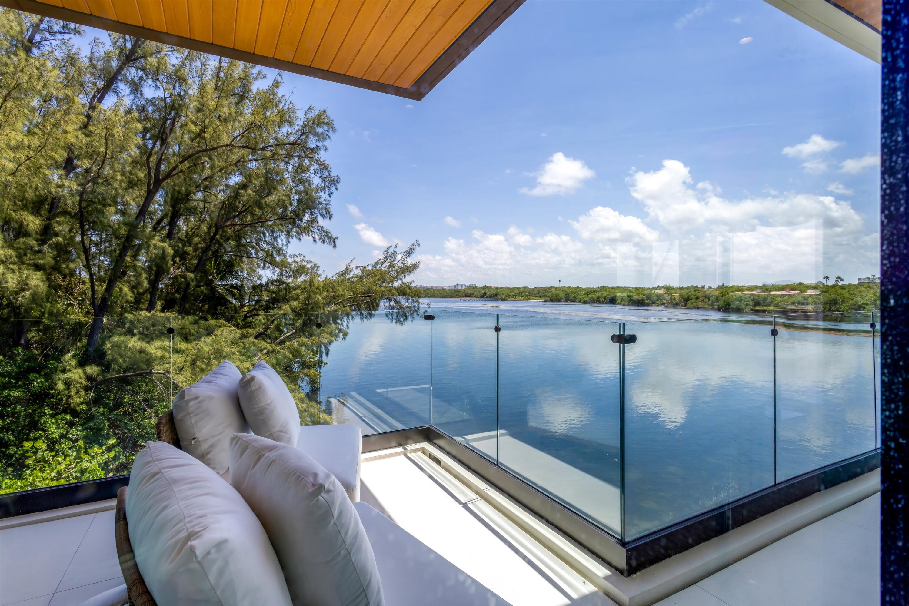 900 Lago Mar Lane, Unit PH Boca Raton, FL 33431 - Photo 34 of 58 a view of a balcony with chair and table