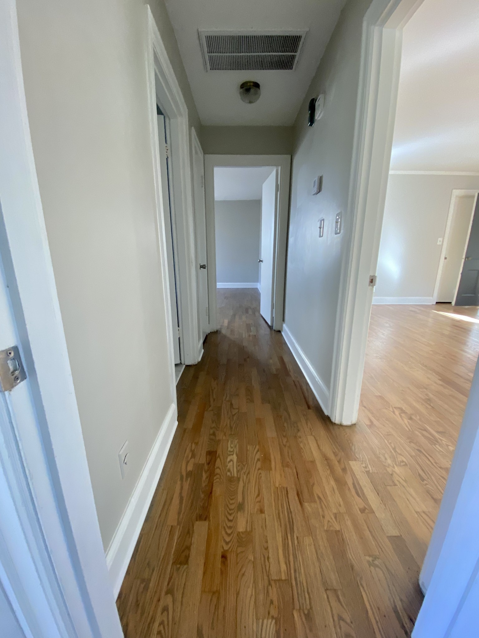 103 Lauderdale Road, Unit B Nashville, TN 37205 - Photo 11 of 17 a view of a hallway with wooden floor and staircase