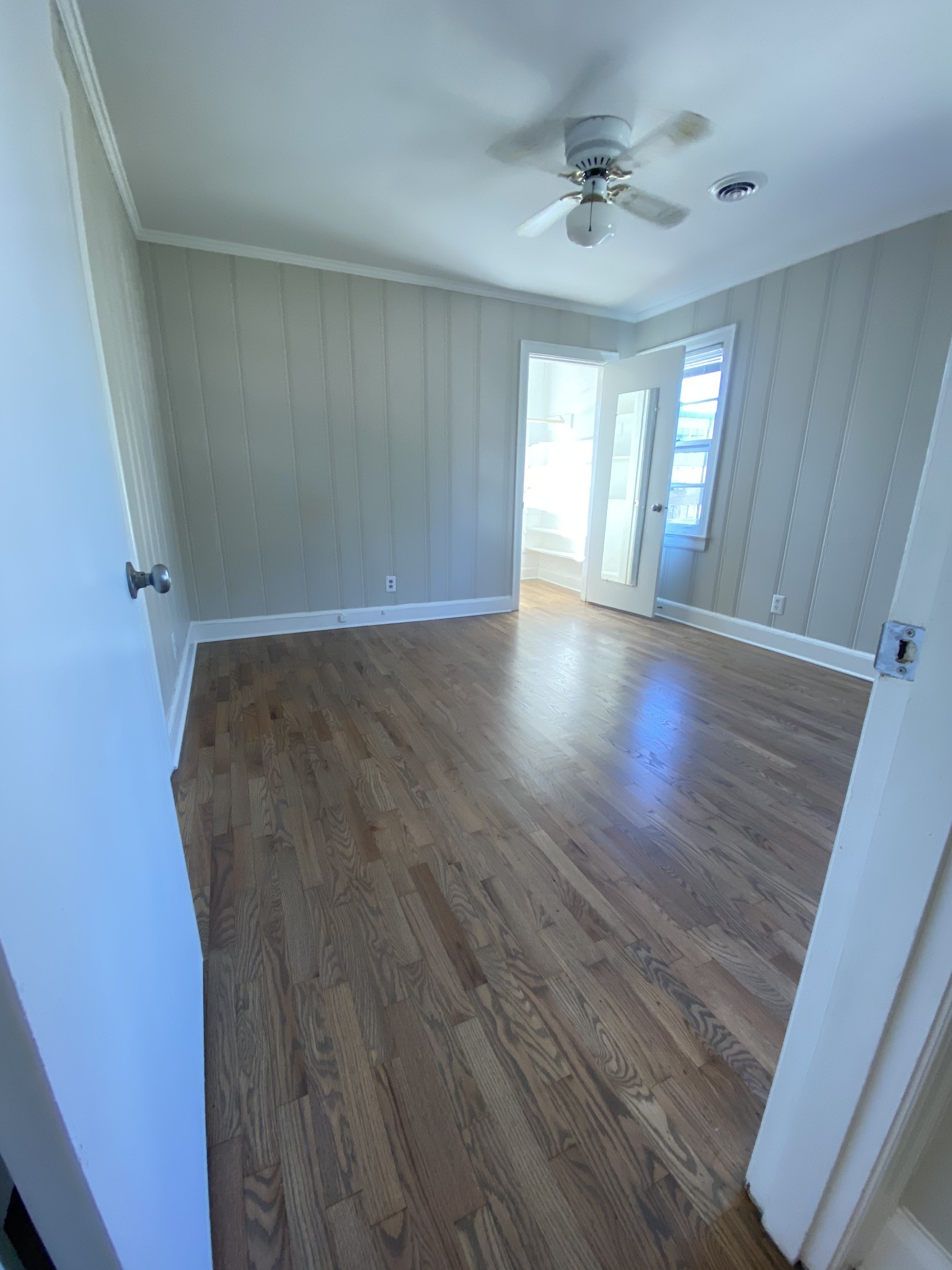 103 Lauderdale Road, Unit B Nashville, TN 37205 - Photo 9 of 17 wooden floor in an empty room with a window