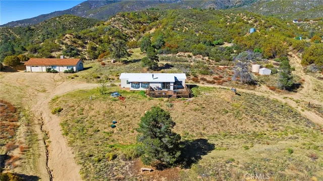 a aerial view of residential houses with outdoor space