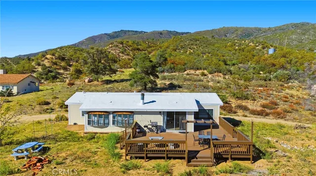 an aerial view of a house with a garden