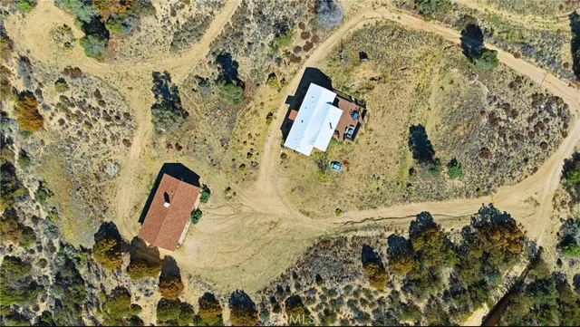 a view of a car park in front of a house