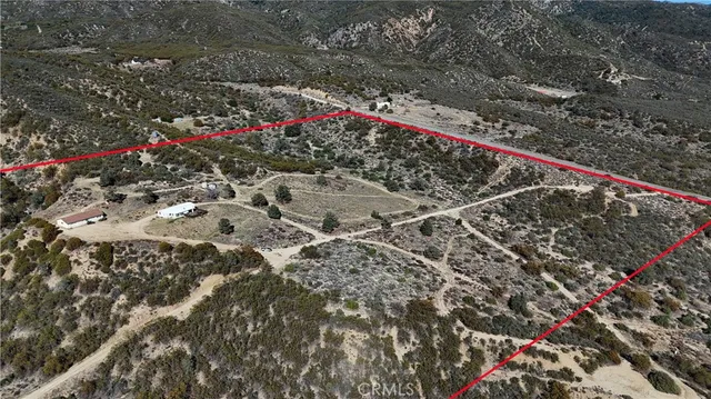 a view of kitchen and dining area with wooden floor