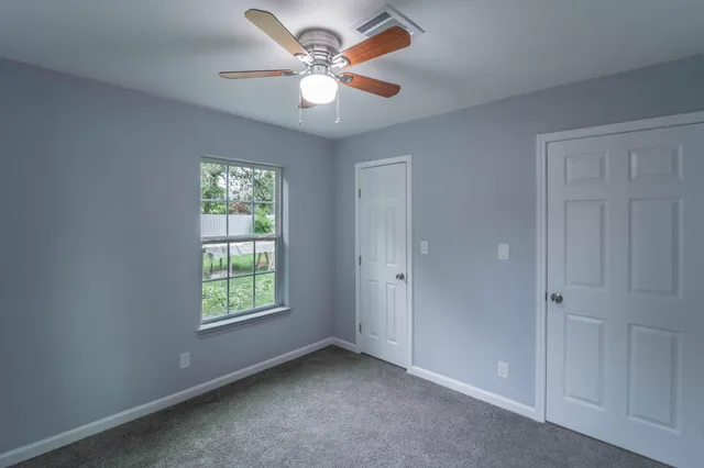 a view of an empty room with a window