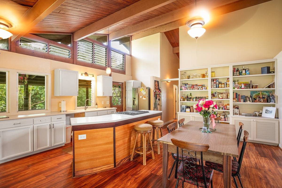 2060 Puukaa Street Kapaa, HI 96746 - Photo 4 of 19 a view of a dining room with furniture window and wooden floor