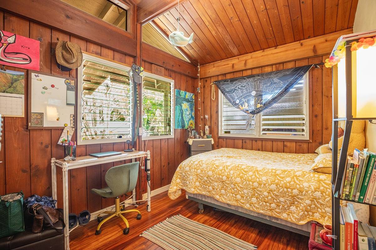 2060 Puukaa Street Kapaa, HI 96746 - Photo 7 of 19 a bedroom with a bed and wooden floor
