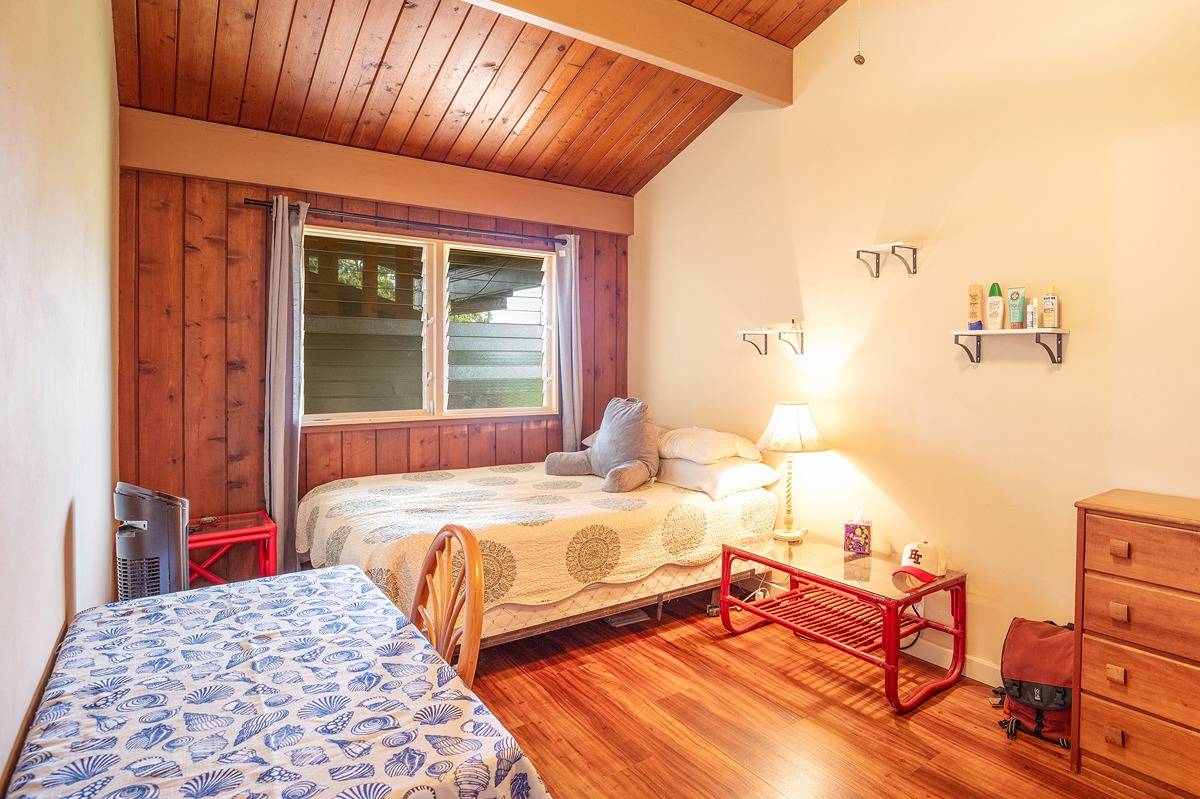2060 Puukaa Street Kapaa, HI 96746 - Photo 8 of 19 a bedroom with a bed and wooden floor